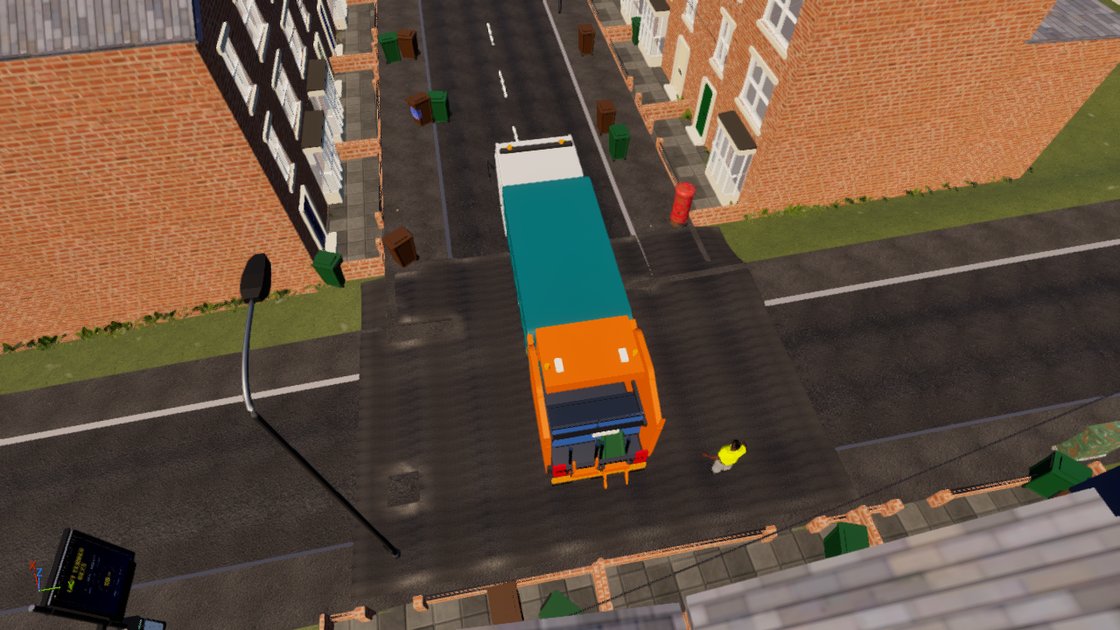 Overhead view of the refuse lorry stopped on a terraced street with a loader in hi-vis at the rear hopper, wheelie bins and a red post box on the pavements.