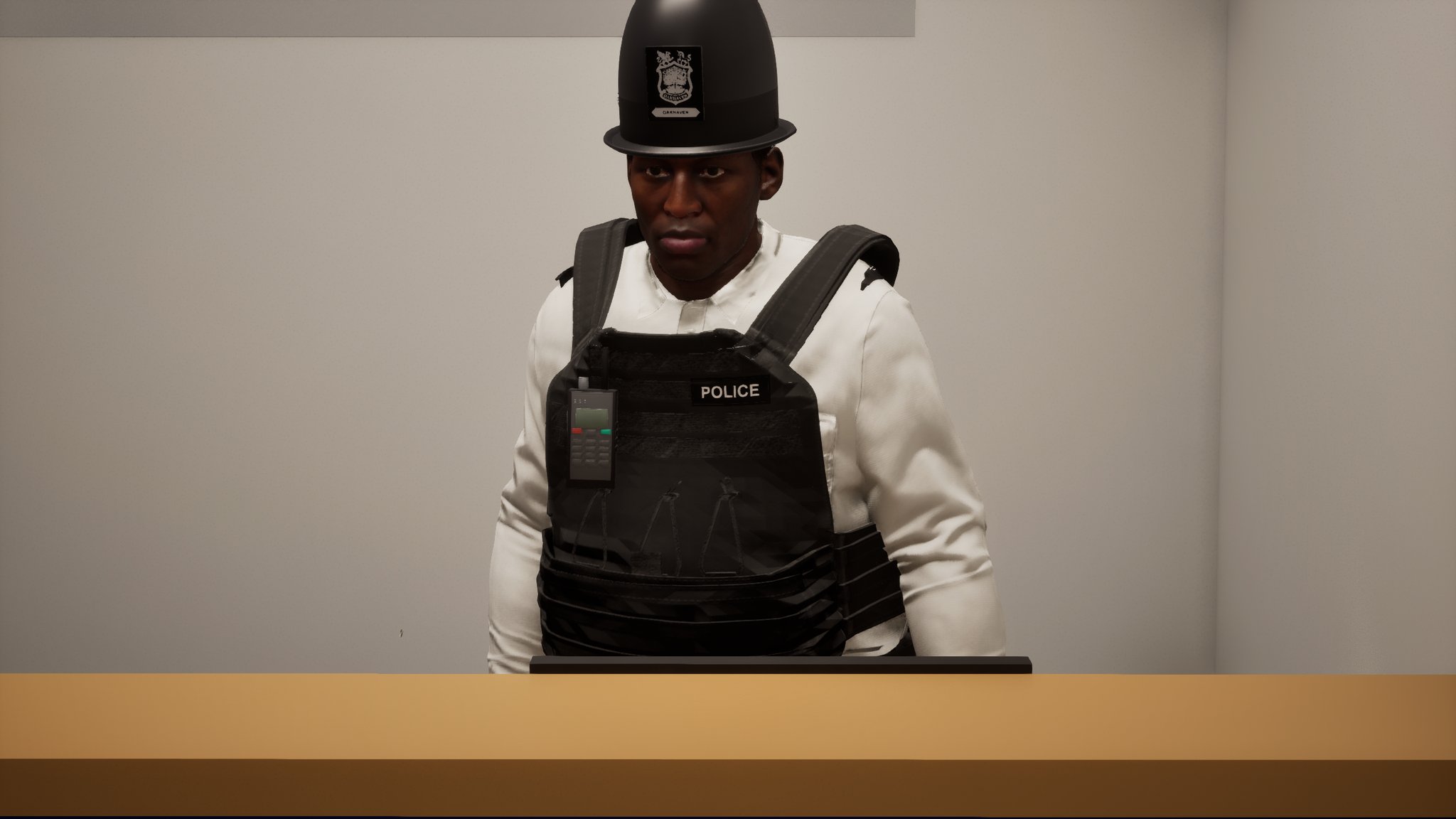A police officer in a custodian helmet stands behind a wooden counter in a white shirt and a black vest marked POLICE, with a radio clipped to the left of his chest.