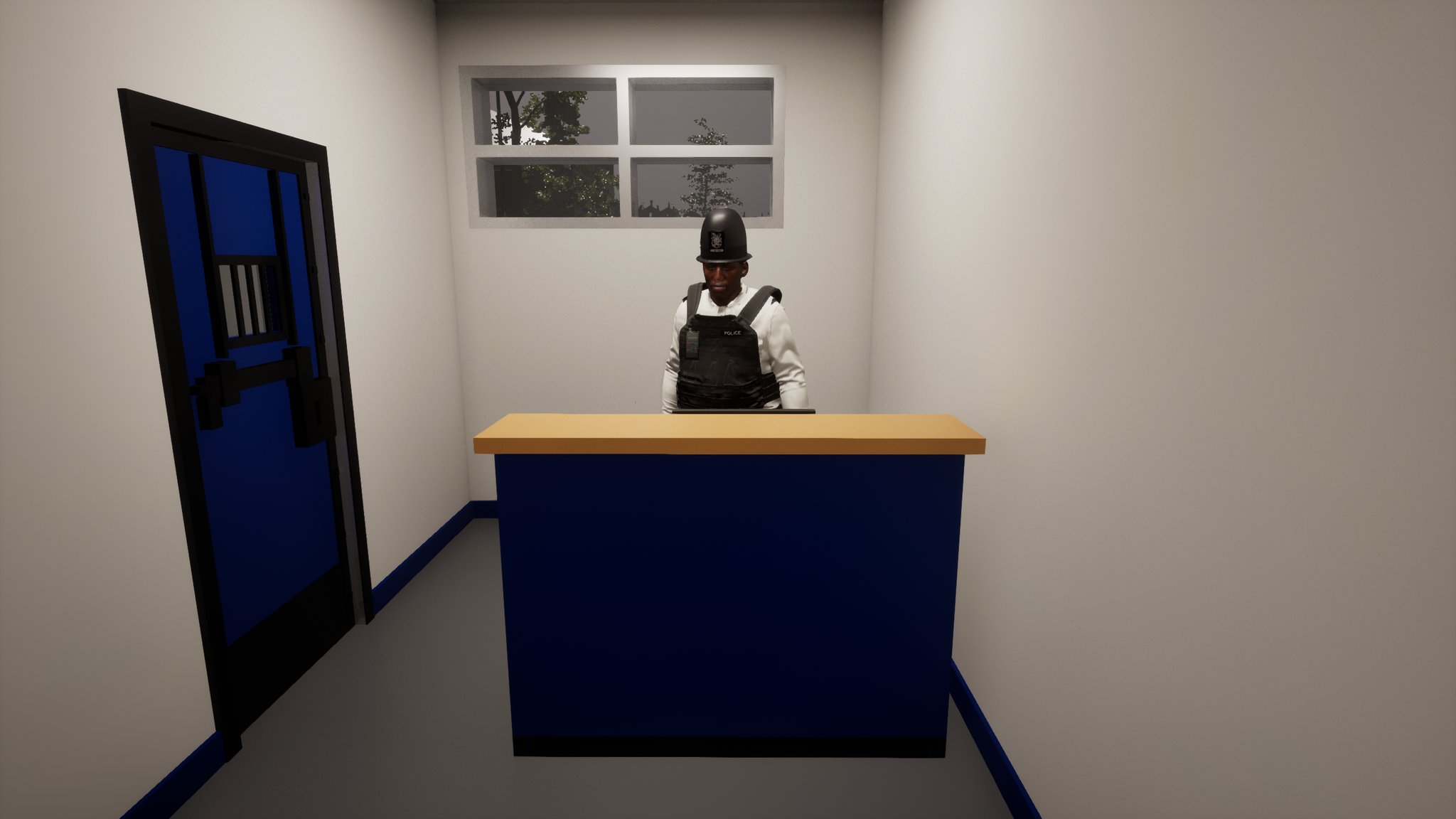 A narrow custody room with a blue cell door on the left and the officer in his vest behind a blue-fronted desk, a window above him.
