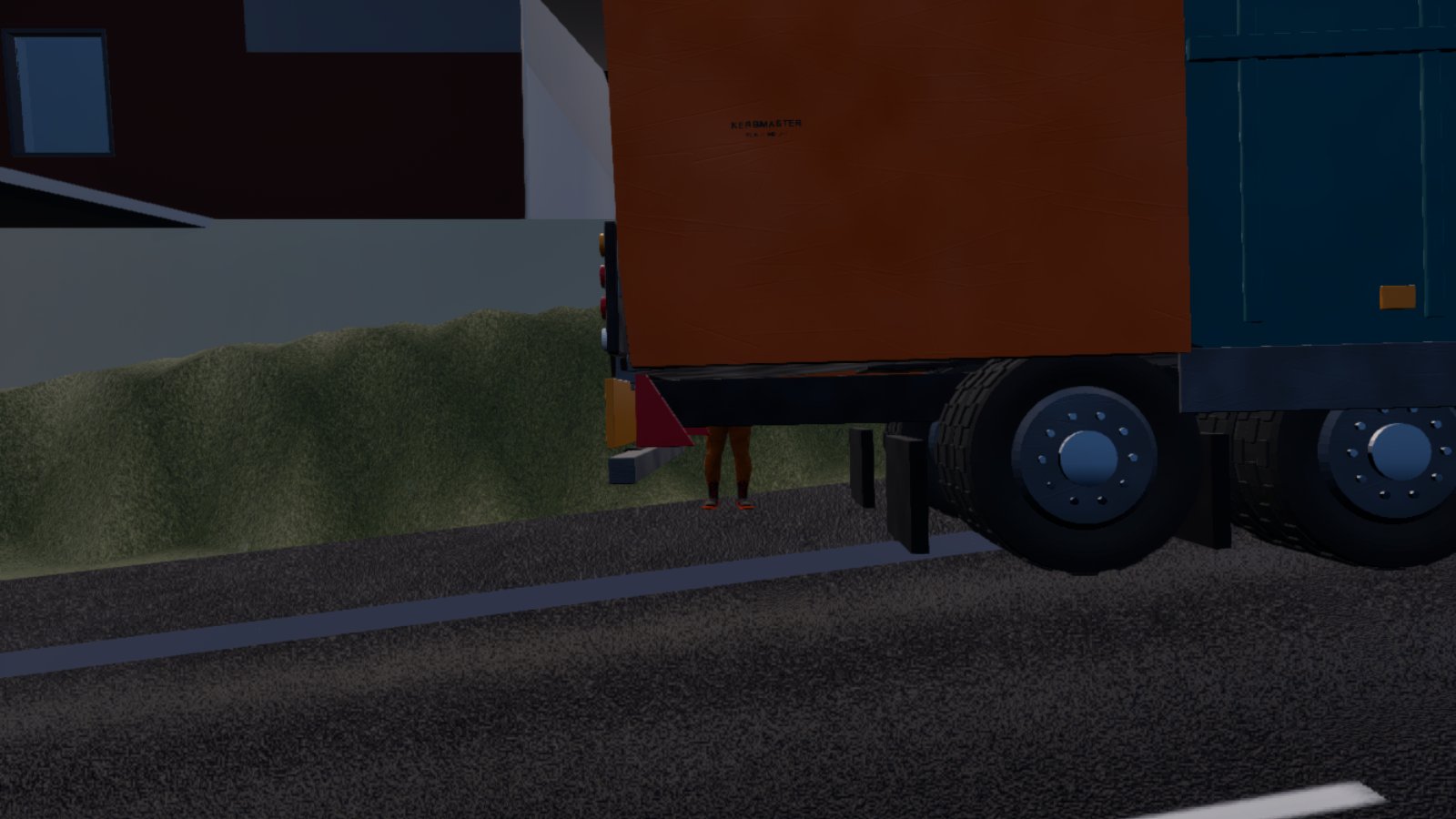 The rear of a parked refuse lorry at dusk, its orange tailgate and wheels filling the frame, with only a man's lower legs and boots visible in the gap beneath it.