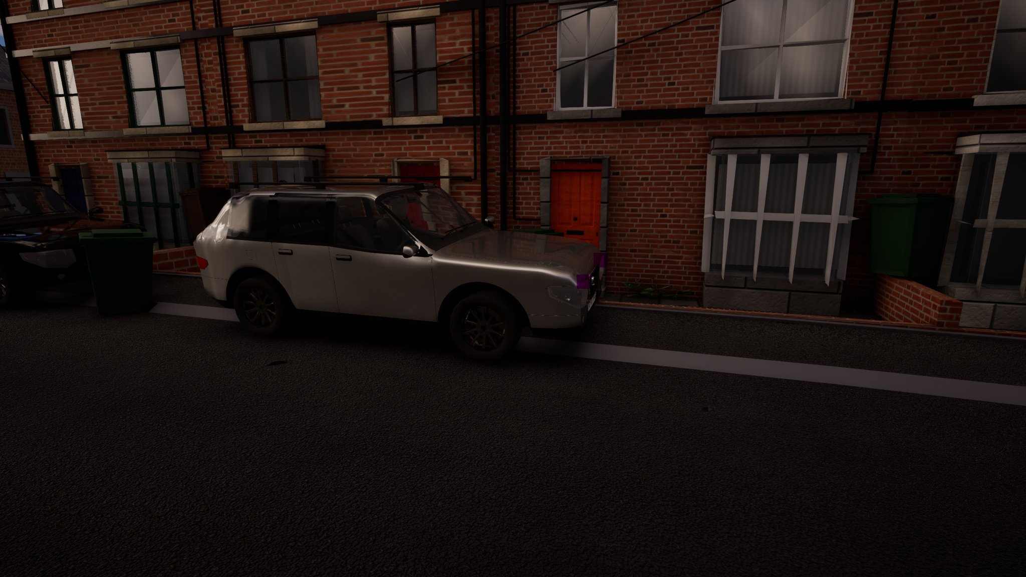 A red-brick terraced street in daylight. A white estate car is parked tight against the kerb across the front of a house, right in line with its garden gate and red front door.