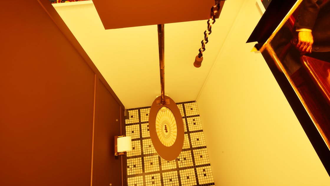 Inside a pub toilet cubicle looking down: a high-level cistern with a pull chain, mosaic floor tiles and a toilet roll holder on the partition.