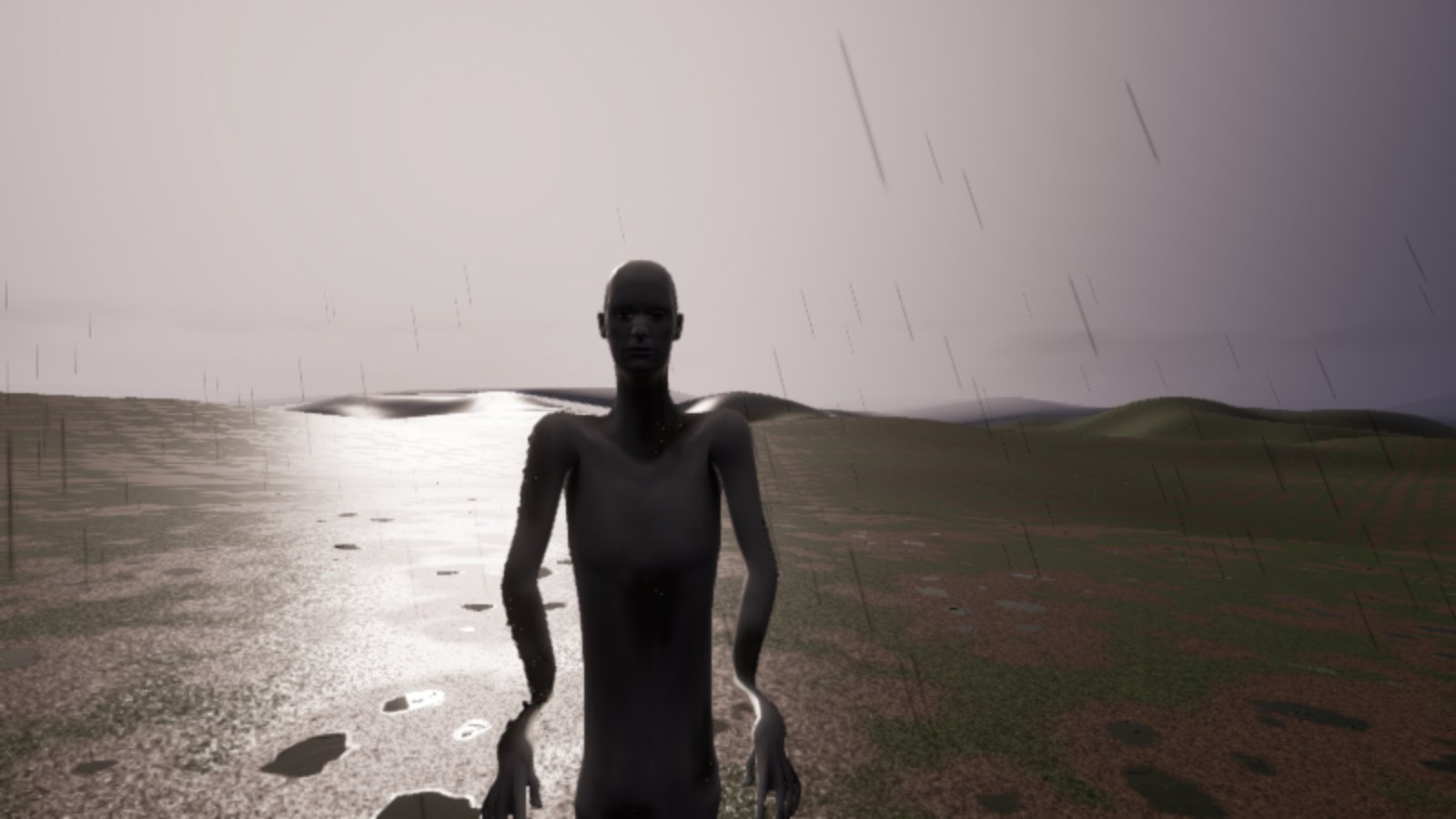 A tall, thin, dark grey figure stands close in front of the viewer in heavy rain on wet open ground, long arms hanging at its sides, low hills behind it in grey light.