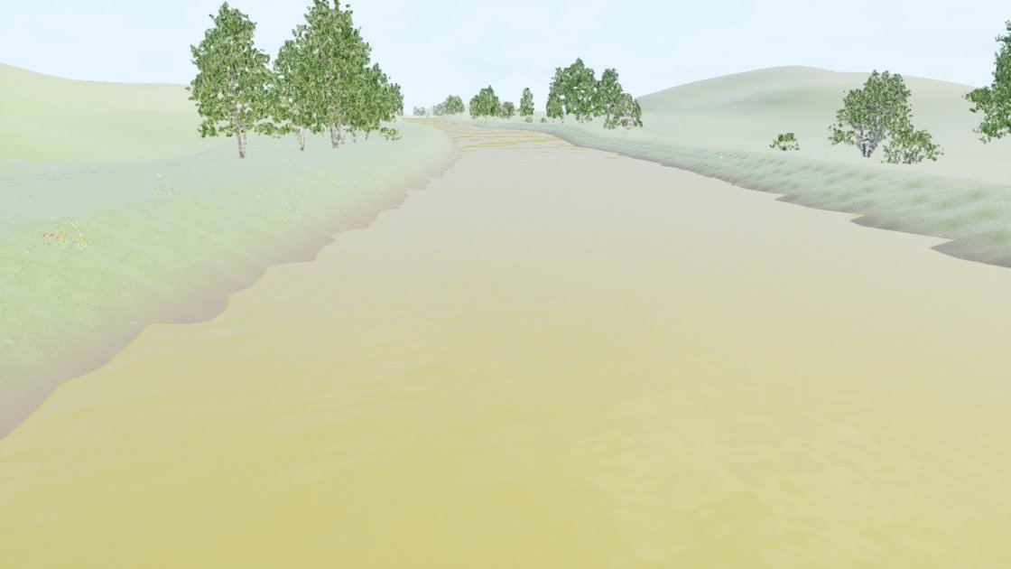 A low view along a river between grassy banks, the water filling the channel from bank to bank under a hazy pale sky, with trees on both banks and low hills behind.