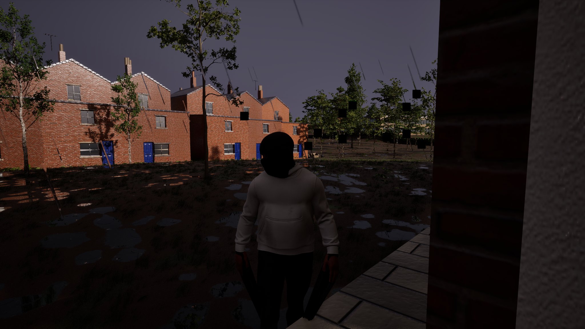 At dusk on an estate, a lad in a white hoodie with a black balaclava over his face walks past the corner of a brick wall. Small black squares hang in the air over the green behind him.
