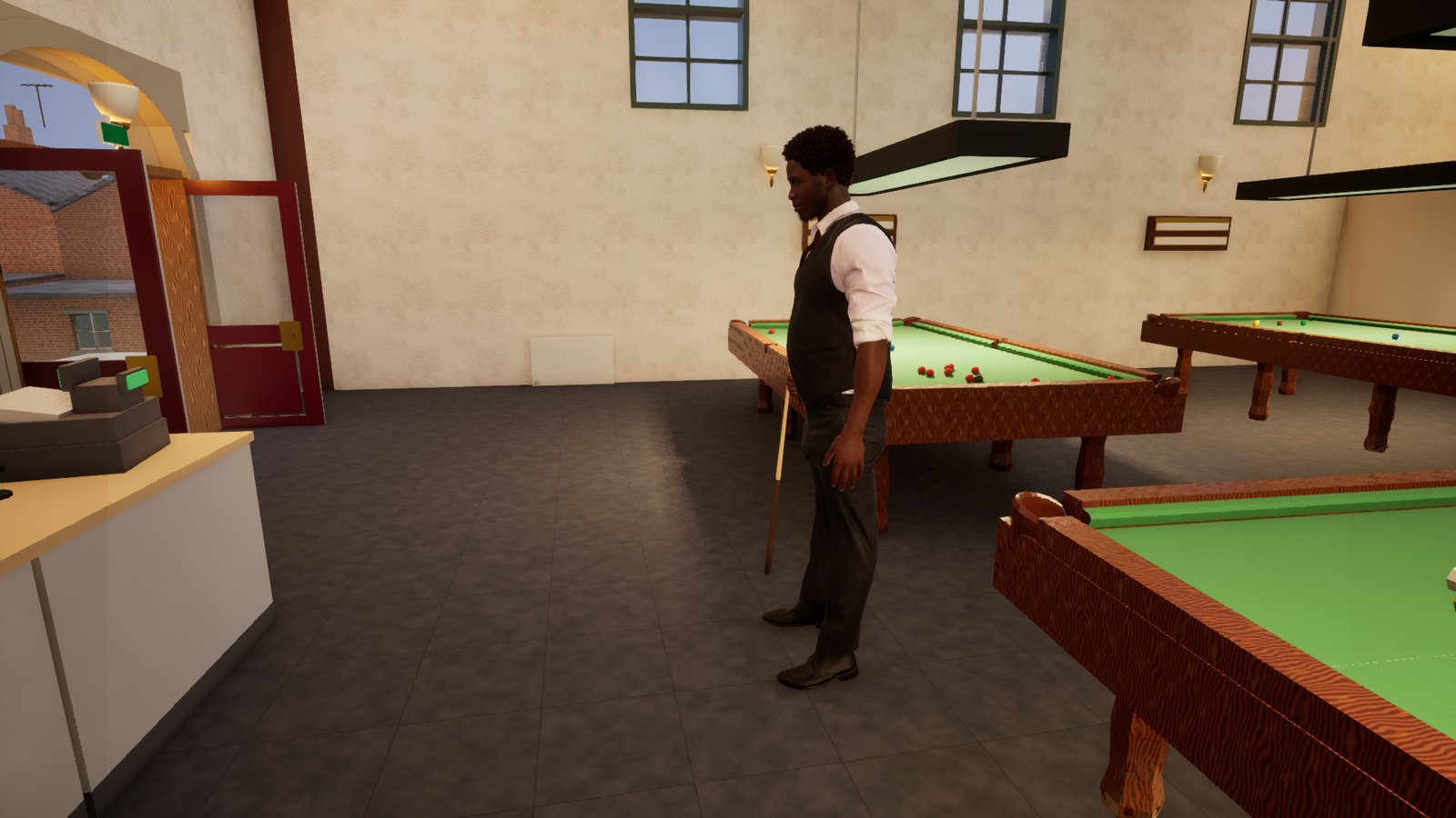 A bearded man in a dark waistcoat, white shirt with rolled sleeves and dark tie stands beside a snooker table holding a cue upright with its butt on the floor, looking down the table at a rack of reds. Brass sconces and a shaded table light hang on the papered wall behind him, with the club counter and a doorway onto a sunlit street at the left.