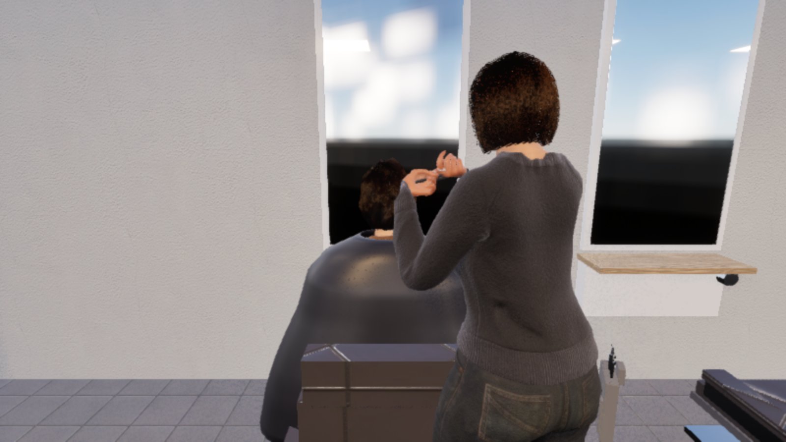 From behind, a hairdresser in a grey jumper stands at a seated customer in a grey cape, her hands raised with the scissors at the back of the customer's head, by a tall window.