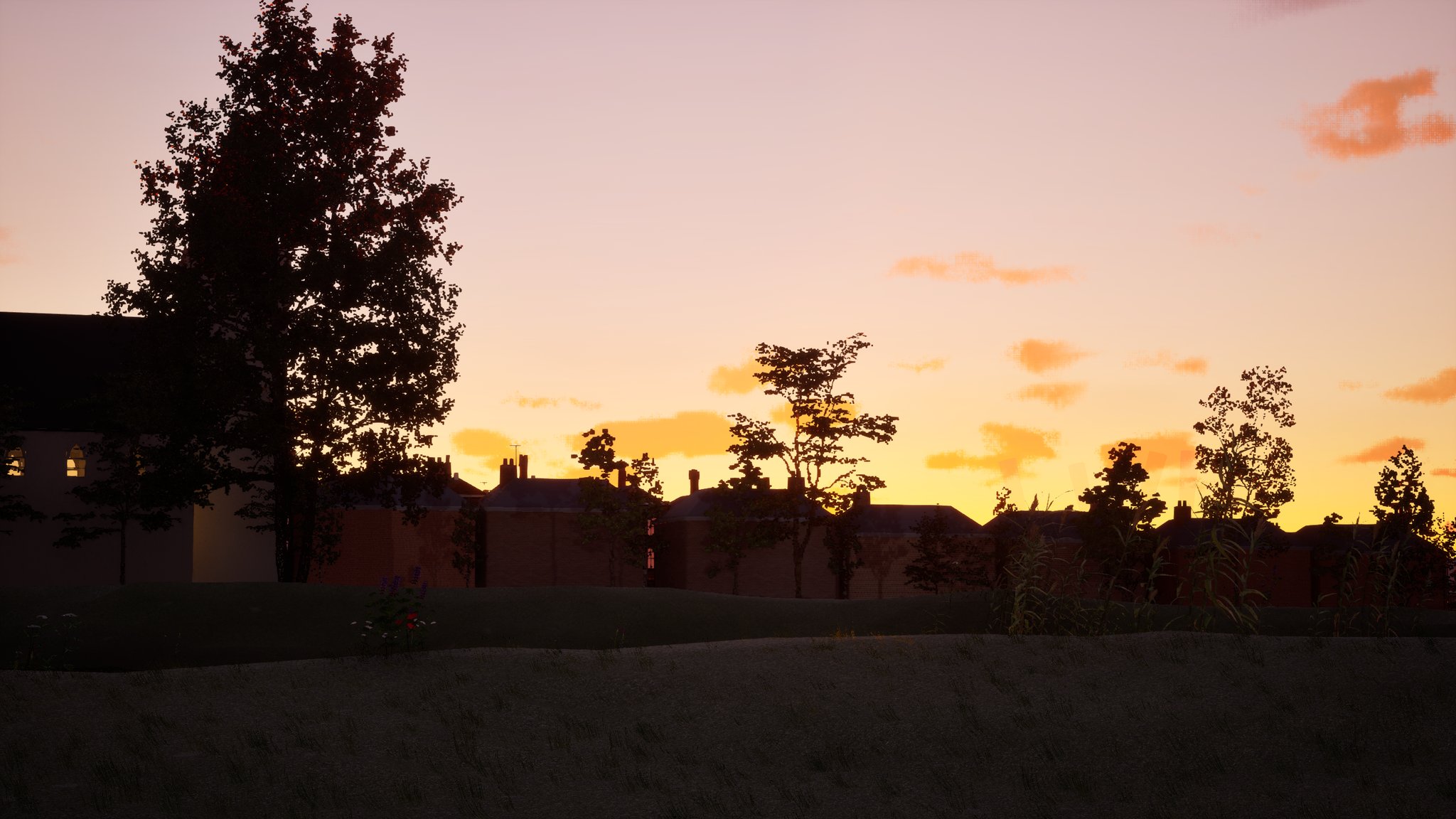 A dusk skyline of terraced houses and chimney stacks in silhouette against an orange band of sky, with a large tree on the left and a dark field in front.