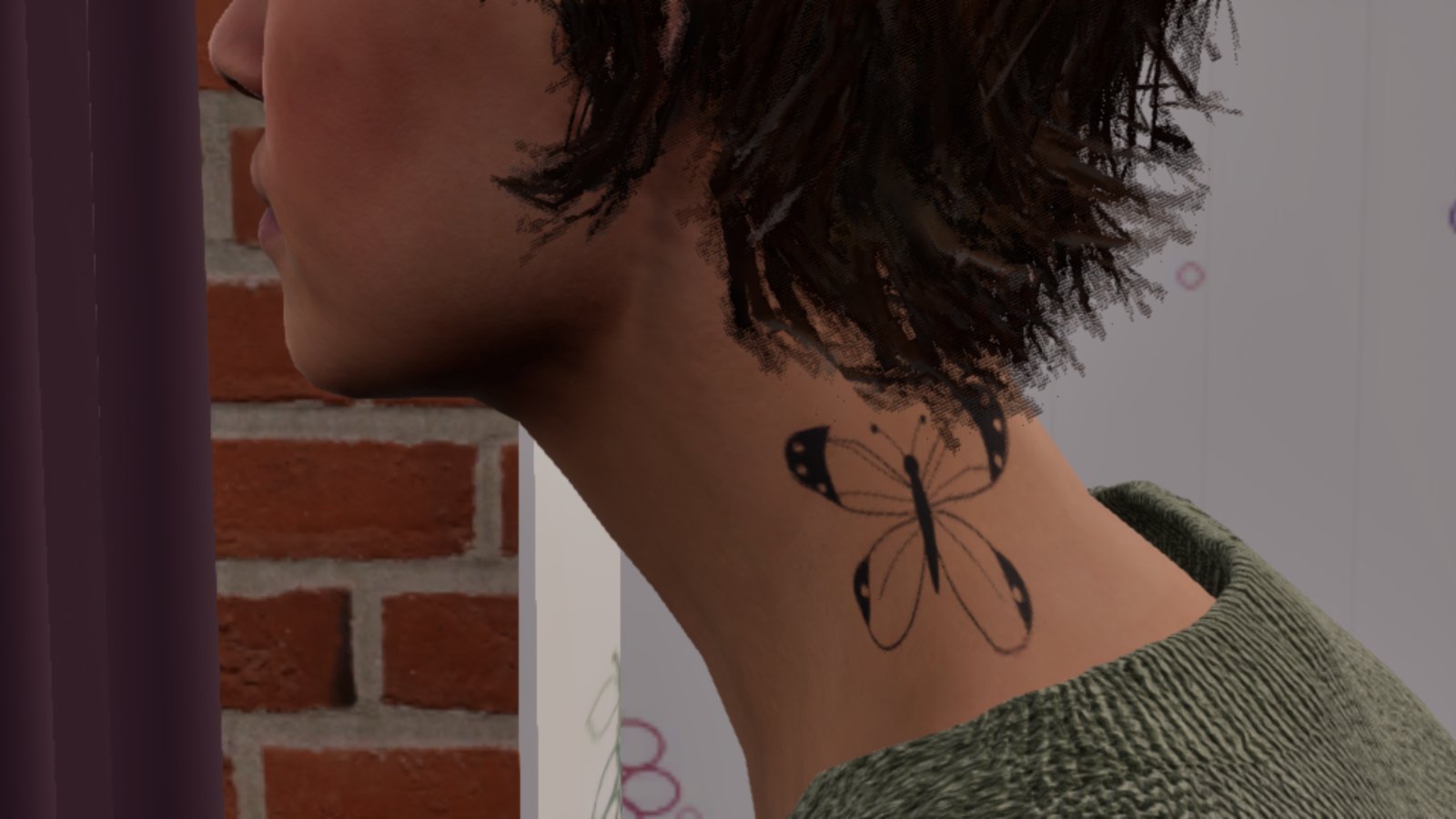 The same woman's neck from the side, with a black outlined butterfly tattoo sitting clear below the hairline and above the collar of her green jumper.
