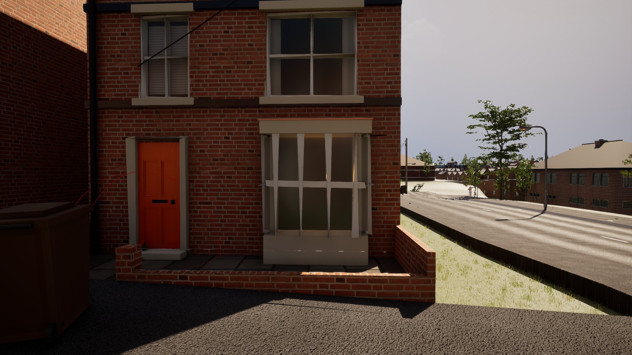 The front of a red-brick terraced house with an orange painted door. A projecting bay window to the right of the door has pale curtains hanging as narrow strips down each side, leaving the glass clear in the middle, and the room behind it is lit. A brown wheelie bin stands at the left edge, and the road falls away to the right.