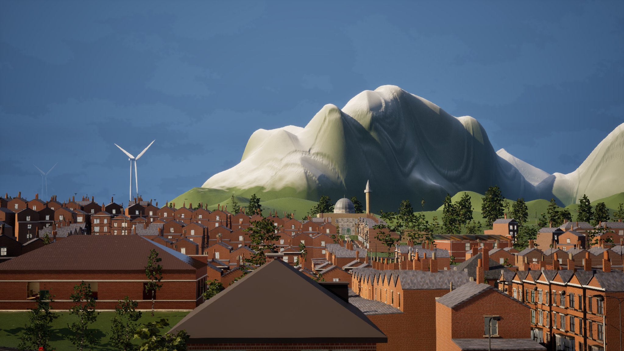 Looking across the red-brick terraced rooftops of a town, chimneys and slate roofs in rows, a mosque dome and minaret in the middle distance. Two white wind turbines stand on the skyline to the left and a large pale hill rises behind the town.