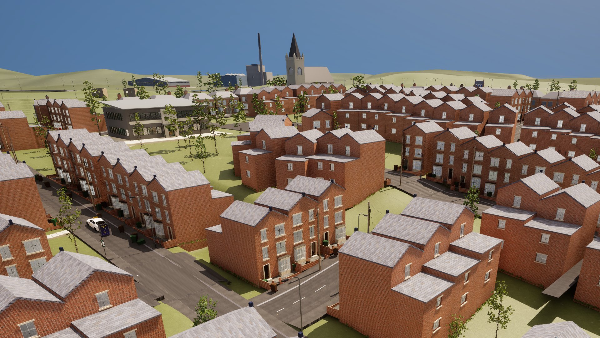 Red-brick terraces from above, and on the skyline a tall thin chimney beside a church tower and spire.