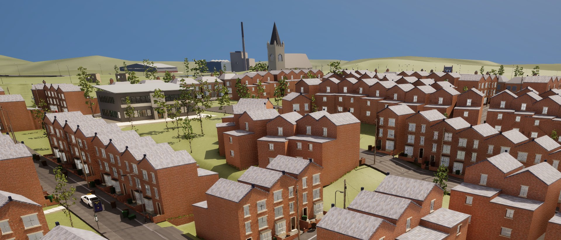 Rows of red-brick terraces with grey slate roofs seen from above, and on the skyline the tower and spire of St Cuthbert's beside the taller incinerator chimney.