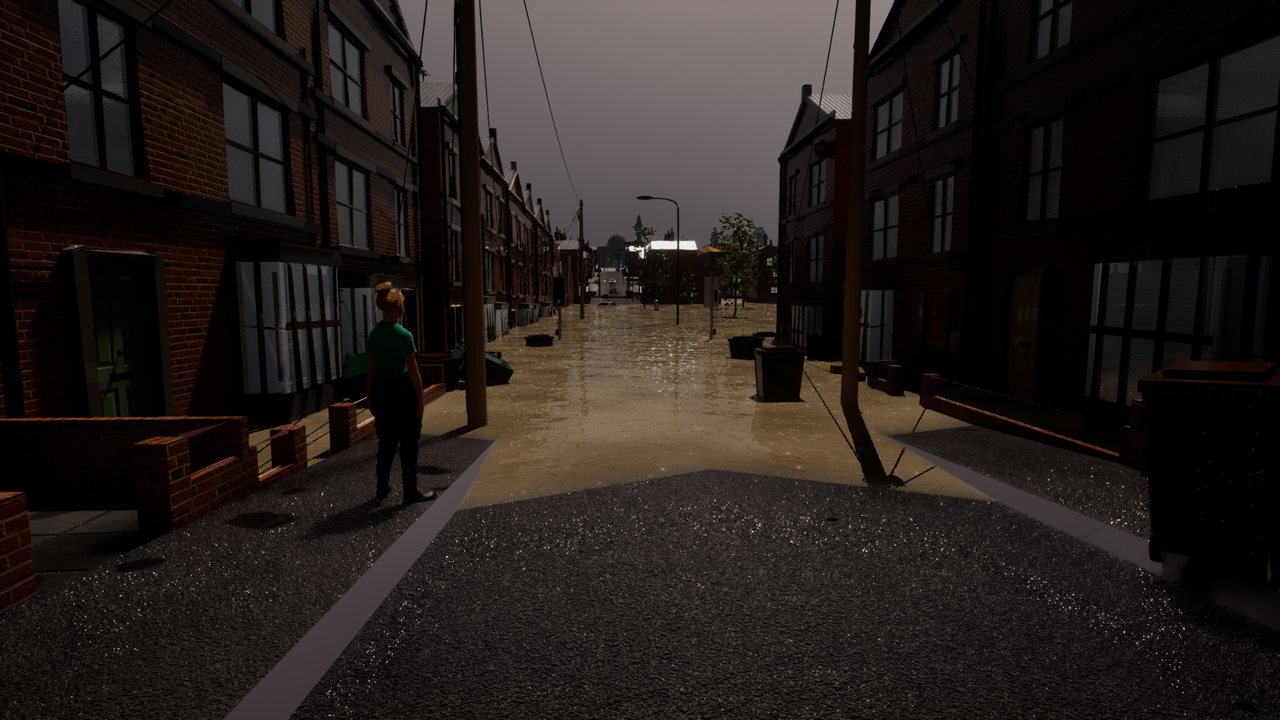 A woman in a green top standing on the pavement of a terraced street, looking down the road at brown floodwater filling it from kerb to kerb.