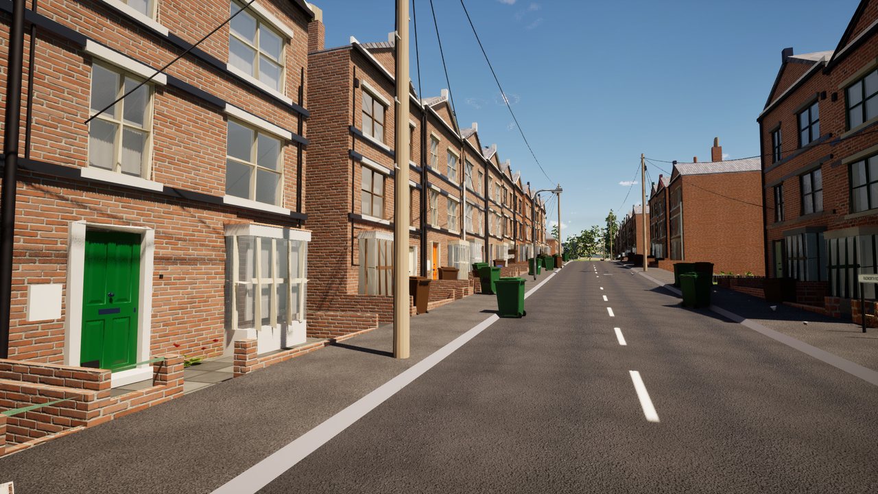 A terraced street at midday under a deep blue sky with a few white clouds, a green front door and wheelie bins on the pavement.